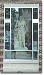 Statue of Ben behind glass
