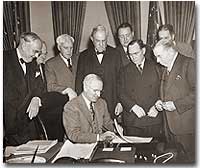 Truman signs the Marshall Plan