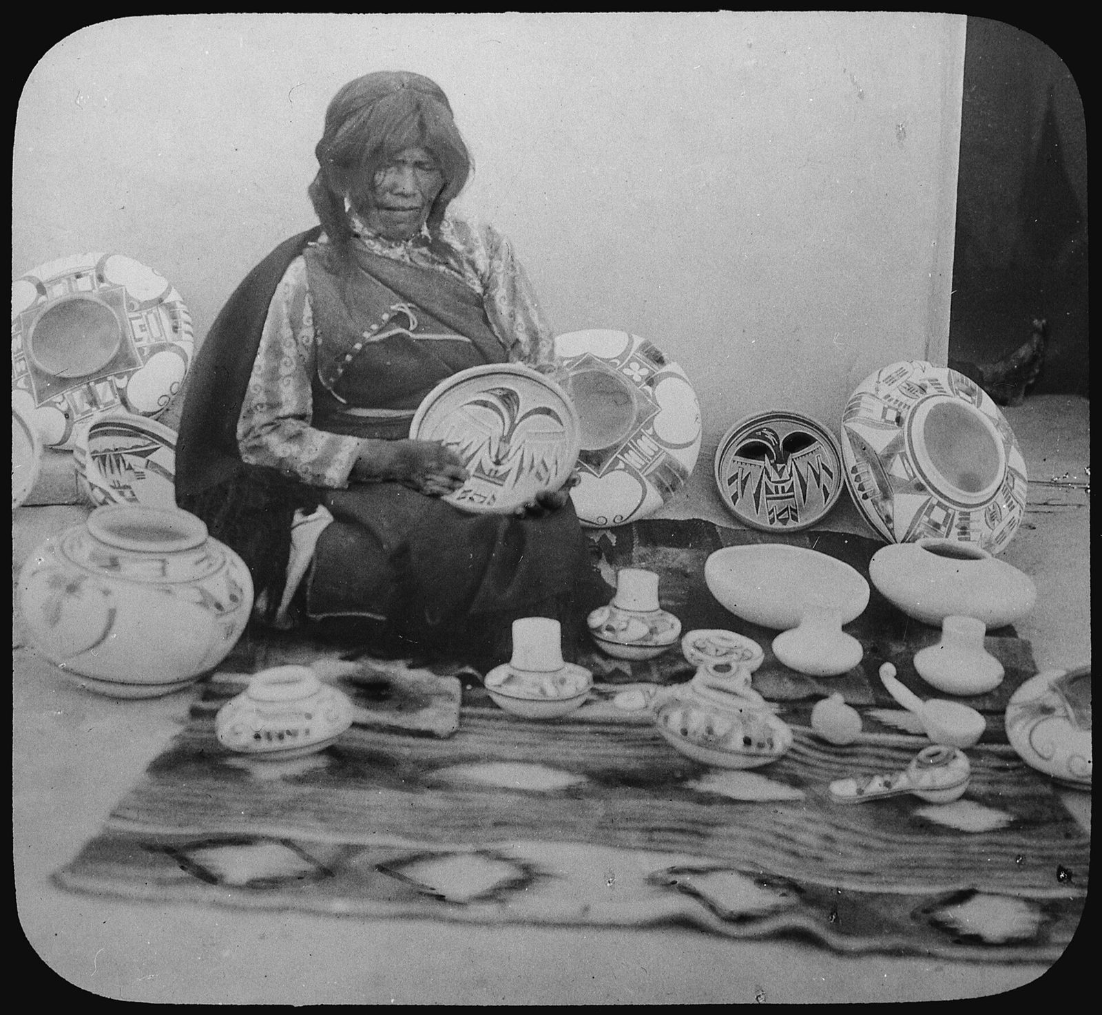 Nampeyo, a Hopi-Tewa potter, with examples of her work in 1900