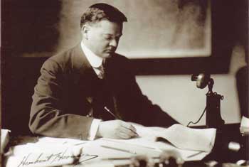 Herbert Hoover at a desk