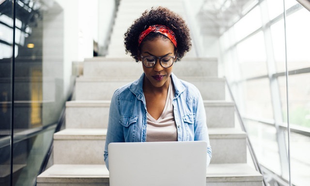 young African-American woman with a laptop